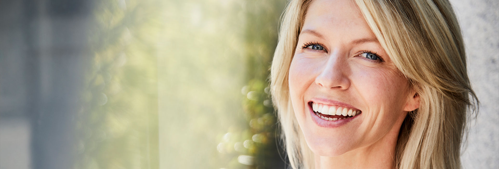 Beautiful woman smiling after teeth whitening