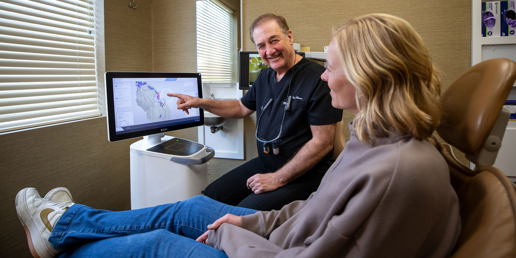 Doctor going over dental scan of Patients mouth
