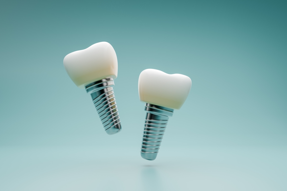 Dentist consulting a patient about dental implants in a modern clinic.